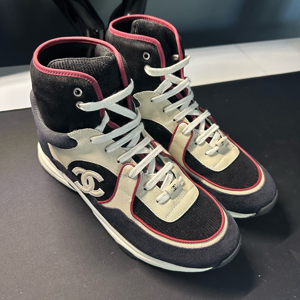 CHANEL Black and Cream High-Top Sneakers with Red Trim